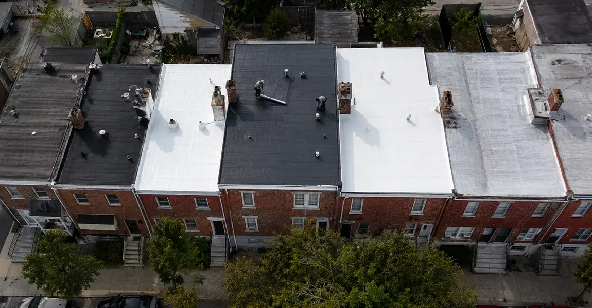 Home Spennato Family Roofing Overhead photo showing flat roof options in Philadelphia rowhome roofing systems